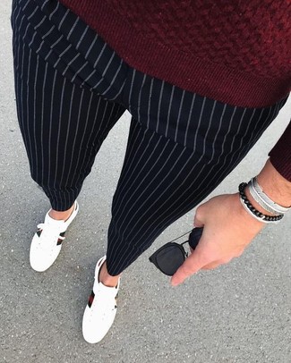 Men's Black Sunglasses, White Leather Low Top Sneakers, Black Vertical Striped Dress Pants, Burgundy Crew-neck Sweater