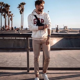 Men's Black Canvas Fanny Pack, Beige Canvas Low Top Sneakers, Beige Jeans, White and Red Print Hoodie