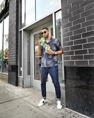 Men's Dark Green Sunglasses, White Print Leather Low Top Sneakers, Navy Jeans, Navy and White Floral Short Sleeve Shirt