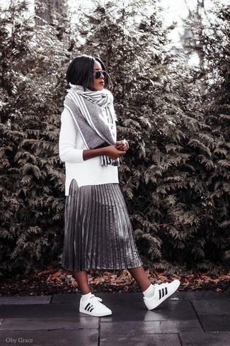 Women's Grey Vertical Striped Scarf, White and Black Leather Low Top Sneakers, Silver Pleated Midi Skirt, White Crew-neck Sweater