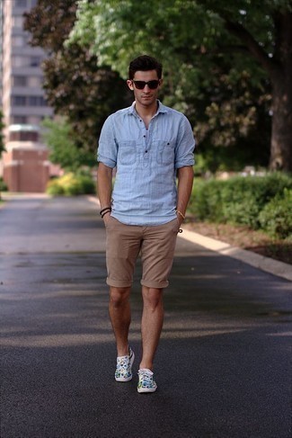 Men's Dark Brown Sunglasses, Multi colored Print Canvas Low Top Sneakers, Tan Shorts, Light Blue Linen Long Sleeve Shirt