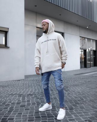 Men's Pink Beanie, White Leather Low Top Sneakers, Blue Ripped Skinny Jeans, White Fleece Hoodie