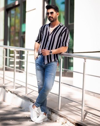 Men's Burgundy Sunglasses, White Leather Low Top Sneakers, Blue Ripped Skinny Jeans, Black and White Vertical Striped Long Sleeve Shirt