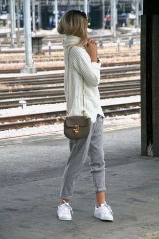 Women's Olive Leather Crossbody Bag, White Low Top Sneakers, Grey Tapered Pants, White Knit Oversized Sweater