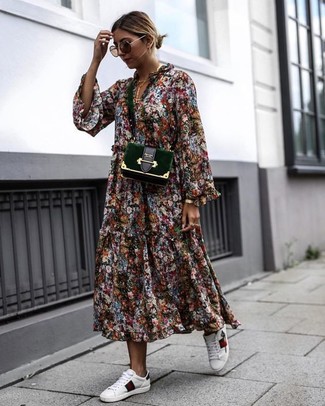 1200+ Hot Weather Outfits For Women: Make a multi colored floral midi dress your outfit choice to pull together an interesting and modern-looking laid-back outfit. Add a pair of white leather low top sneakers to this ensemble to keep the getup fresh.