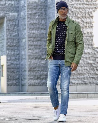 Navy Crew-neck Sweater Casual Outfits For Men: If you're after an edgy yet on-trend ensemble, wear a navy crew-neck sweater with blue ripped jeans. Get a bit experimental when it comes to shoes and introduce white canvas low top sneakers to the equation.