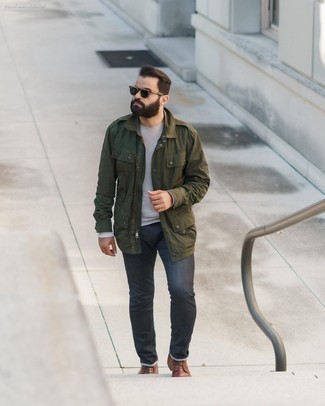 Olive Military Jacket Outfits For Men: An olive military jacket and charcoal jeans are the kind of a fail-safe off-duty ensemble that you so terribly need when you have no extra time. Introduce a pair of brown leather casual boots to the mix to jazz things up.