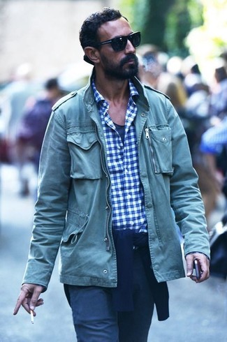Green Military Jacket Outfits For Men: This pairing of a green military jacket and navy chinos is a safe go-to for a ridiculously stylish look.