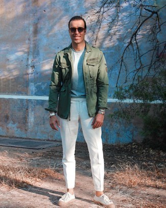 Olive Military Jacket Outfits For Men: An olive military jacket and white chinos are true menswear staples if you're picking out a casual closet that holds to the highest sartorial standards. Play down the dressiness of your getup by rounding off with white canvas low top sneakers.