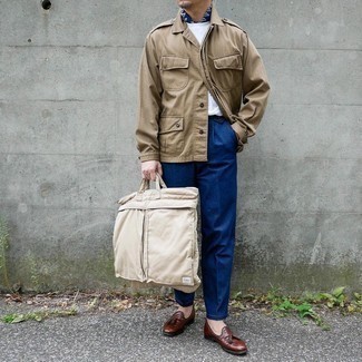 Tan Canvas Tote Bag Outfits For Men: This casual street style pairing of a khaki military jacket and a tan canvas tote bag can only be described as devastatingly dapper. When it comes to shoes, go for something on the dressier end of the spectrum by finishing with brown leather tassel loafers.