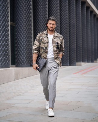 Beige Military Jacket Outfits For Men: Reach for a beige military jacket and grey chinos for a casual and trendy getup. White canvas low top sneakers will add an air of stylish effortlessness to an otherwise classic getup.