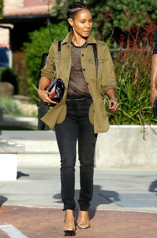 Jada Pinkett Smith wearing Olive Military Jacket, Black Mesh Crew-neck T-shirt, Black Jeans, Gold Leather Heeled Sandals