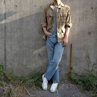Beige Military Jacket Outfits For Men: If you feel more confident wearing something practical, you'll like this dapper pairing of a beige military jacket and light blue jeans. Add white leather low top sneakers to this ensemble to immediately boost the style factor of this ensemble.