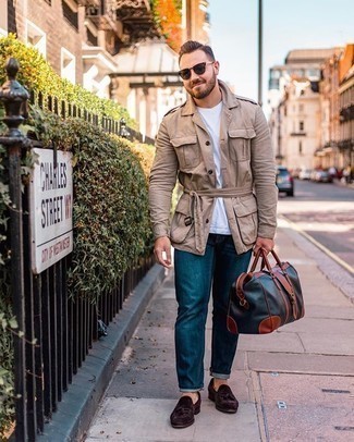 Navy Leather Holdall Outfits For Men: Try pairing a khaki military jacket with a navy leather holdall for a laid-back getup that's easy to pull together. To introduce a bit of zing to your look, complete your outfit with a pair of dark brown suede tassel loafers.