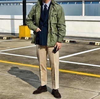 Olive Military Jacket Outfits For Men: To look like a refined gent, try pairing an olive military jacket with beige dress pants. If you're hesitant about how to finish off, a pair of dark brown suede brogues is a savvy idea.