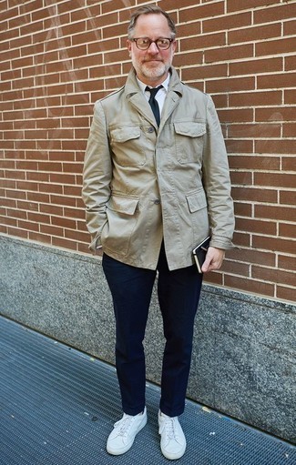 Khaki Military Jacket Outfits For Men: This pairing of a khaki military jacket and navy chinos looks well-executed and makes you look infinitely cooler. If you wish to effortlessly tone down your ensemble with a pair of shoes, why not introduce white leather low top sneakers to this ensemble?