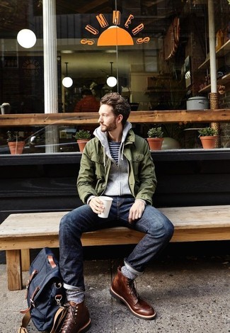 Dark Green Military Jacket Outfits For Men: Why not wear a dark green military jacket with navy jeans? As well as very practical, both of these items look amazing when matched together. Avoid looking too casual by finishing with a pair of dark brown leather casual boots.