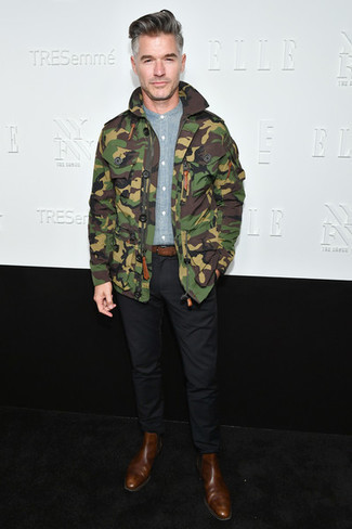Olive Camouflage Military Jacket Outfits For Men: Combining an olive camouflage military jacket with black chinos is an on-point idea for a laid-back yet on-trend look. Complete this look with a pair of brown leather chelsea boots to instantly switch up the ensemble.