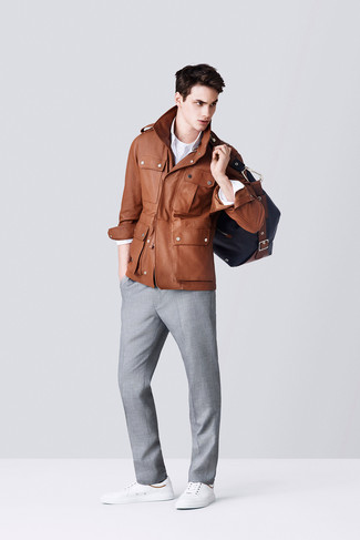 Military Jacket Outfits For Men: This sophisticated combination of a military jacket and grey dress pants is a must-try ensemble for today's gentleman. You could perhaps get a bit experimental in the footwear department and complement your outfit with a pair of white leather low top sneakers.