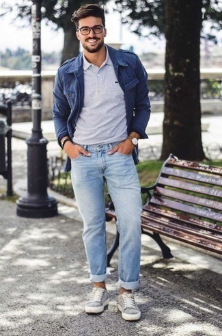 Navy Military Jacket Outfits For Men: For a goofproof relaxed casual option, you can't go wrong with this combo of a navy military jacket and light blue jeans. Don't know how to round off? Add a pair of grey canvas low top sneakers to this getup to change things up a bit.