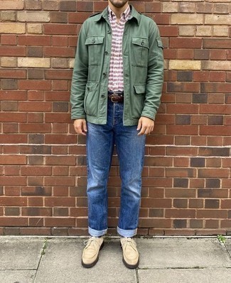 Olive Military Jacket Outfits For Men: This combo of an olive military jacket and blue jeans is indisputable proof that a straightforward casual ensemble can still look really sharp. Complement your getup with a pair of beige suede desert boots and you're all done and looking awesome.