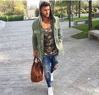 Dark Green Military Jacket Outfits For Men: If you gravitate towards urban ensembles, why not take this combination of a dark green military jacket and blue ripped skinny jeans for a spin? A pair of white low top sneakers immediately lifts up any look.