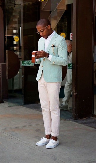 Mint Blazer Outfits For Men: For an ensemble that's street-style-worthy and casually classic, make a mint blazer and beige chinos your outfit choice. Introduce a fun feel to by finishing with a pair of beige low top sneakers.