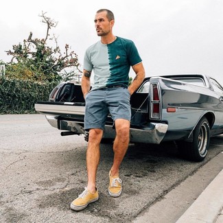 Mint Acid Wash Crew-neck T-shirt Outfits For Men: Marrying a mint acid wash crew-neck t-shirt with grey shorts is an on-point option for a casually stylish ensemble. Yellow canvas low top sneakers are a savvy choice to round off this outfit.