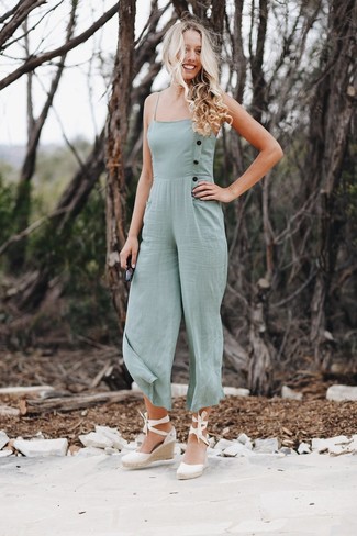 1200+ Cold Weather Outfits For Women: Want to inject your wardrobe with some elegant cool? Wear a mint jumpsuit. All you need is a nice pair of white canvas wedge sandals to finish off your getup.