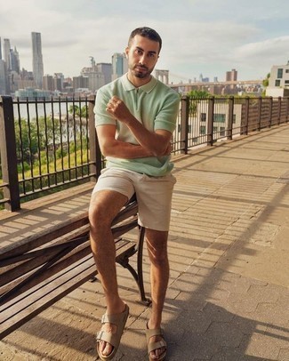 Green Polo Outfits For Men: This sharp ensemble is easy to break down: a green polo and beige shorts. Throw a pair of tan leather sandals into the mix to instantly turn up the wow factor of your getup.