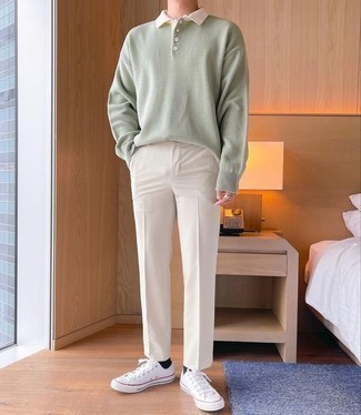 White and Brown Shoes Outfits For Men: Perfect the casually smart ensemble in a mint polo neck sweater and white chinos. As for the shoes, stick to a more casual route with a pair of white canvas low top sneakers.