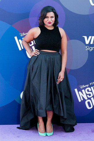 Mindy Kaling wearing Gold Ring, Mint Leather Pumps, Black Pleated Maxi Skirt, Black Cropped Top