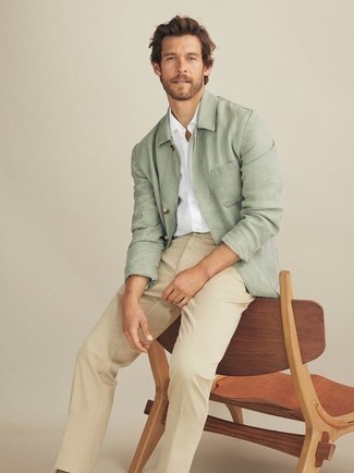 Green Shirt Jacket Outfits For Men: Channel your inner connoisseur of modern men's fashion and wear a green shirt jacket with beige chinos.