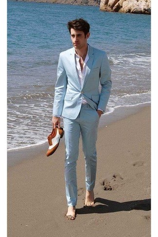 Mint Suit Outfits: This is definitive proof that a mint suit and a white dress shirt are awesome when worn together in a refined ensemble for a modern gentleman. Have some fun with things and add white and brown leather brogues to the equation.