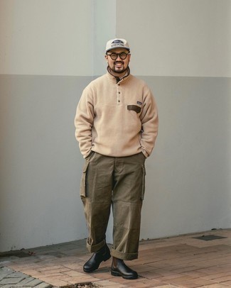 Tan Fleece Mock-Neck Sweater Outfits: A tan fleece mock-neck sweater and olive cargo pants teamed together are a sartorial dream for those dressers who appreciate casually neat getups. A pair of black leather chelsea boots easily dials up the wow factor of your outfit.