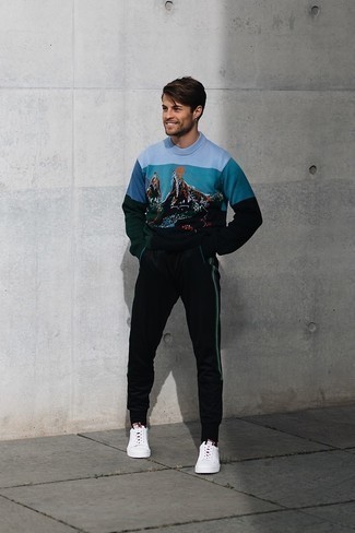 Black Sweatpants Outfits For Men: This casually stylish look is really pared down: a multi colored print crew-neck sweater and black sweatpants. A pair of white canvas low top sneakers will introduce a classic aesthetic to the outfit.