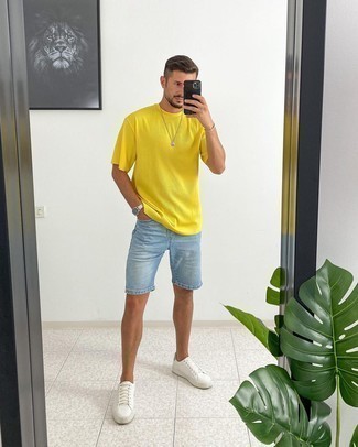 Aquamarine Shorts Outfits For Men: This casual combination of a multi colored crew-neck t-shirt and aquamarine shorts is a foolproof option when you need to look sharp in a flash. This look is finished off wonderfully with a pair of white leather low top sneakers.