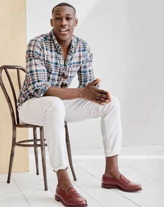 Multi colored Plaid Long Sleeve Shirt Outfits For Men: This off-duty pairing of a multi colored plaid long sleeve shirt and white jeans is capable of taking on different moods according to the way you style it. Not sure how to round off this outfit? Rock a pair of brown leather loafers to turn up the fashion factor.