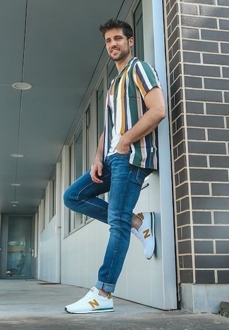 Multi colored Vertical Striped Short Sleeve Shirt Outfits For Men: If you prefer a more relaxed approach to dressing up, why not pair a multi colored vertical striped short sleeve shirt with blue jeans? Complete this ensemble with white athletic shoes to make a mostly dressed-up look feel suddenly edgier.