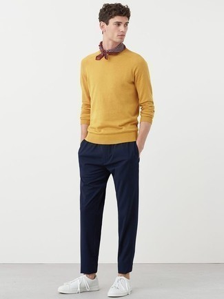 Mustard Crew-neck Sweater Outfits For Men: A mustard crew-neck sweater and navy chinos are an easy way to inject subtle dapperness into your day-to-day lineup. To add a more laid-back vibe to this look, introduce white leather low top sneakers to the equation.