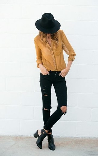 Mustard Dress Shirt Outfits For Women: A mustard dress shirt and black ripped skinny jeans are wonderful staples that will integrate perfectly within your day-to-day collection. Turn up the dressiness of your outfit a bit with black cutout leather ankle boots.