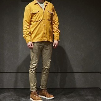Brown Suede Casual Boots Outfits For Men: This combination of a mustard long sleeve shirt and olive chinos is hard proof that a safe casual look doesn't have to be boring. Why not complement your outfit with a pair of brown suede casual boots for an element of sophistication?