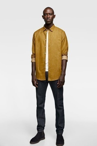 Mustard Long Sleeve Shirt Outfits For Men: This pairing of a mustard long sleeve shirt and charcoal jeans is very easy to imitate and so comfortable to rock over the course of the day as well! Puzzled as to how to finish your ensemble? Finish off with black suede chelsea boots to elevate it.