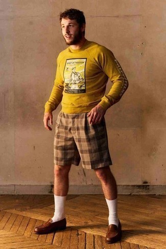 Brown Leather Loafers Outfits For Men: One of the best ways for a man to style out a mustard print sweatshirt is to pair it with tan plaid shorts for a laid-back outfit. A pair of brown leather loafers easily kicks up the fashion factor of your outfit.