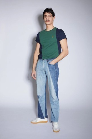 Light Blue Patchwork Jeans Outfits For Men: A navy and green crew-neck t-shirt and light blue patchwork jeans have cemented themselves as veritable wardrobe heroes. Now all you need is a great pair of white leather low top sneakers to complete your outfit.