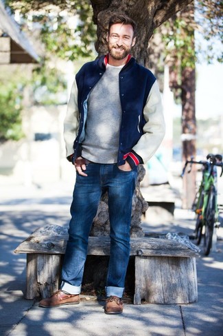 Men's Navy and White Bomber Jacket, Grey Crew-neck Sweater, Blue Jeans, Brown Leather Boat Shoes
