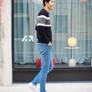 Navy and White Crew-neck Sweater Outfits For Men: Teaming a navy and white crew-neck sweater with blue jeans is an on-point idea for a casual and cool outfit. For a more laid-back spin, why not complete this look with a pair of white canvas high top sneakers?