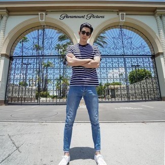 Navy Horizontal Striped Crew-neck T-shirt Outfits For Men: To don a casual outfit with an urban spin, you can always rely on a navy horizontal striped crew-neck t-shirt and light blue jeans. A pair of white canvas low top sneakers is a savvy idea to round off this ensemble.