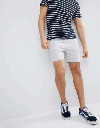 Navy Horizontal Striped Crew-neck T-shirt Outfits For Men: Try pairing a navy horizontal striped crew-neck t-shirt with grey shorts to feel fully confident and look seriously stylish. A pair of navy and white canvas low top sneakers looks wonderful here.