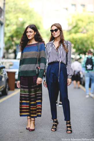 Navy Tapered Pants Outfits For Women: You're looking at the solid proof that a navy and white vertical striped long sleeve blouse and navy tapered pants are amazing when combined together in a casual ensemble. Our favorite of a ton of ways to complete this look is black leather heeled sandals.